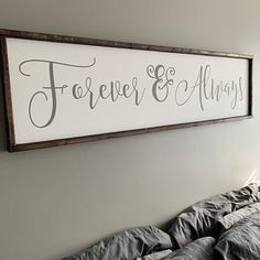 a sign that says forever and always hanging on the wall