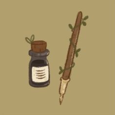 a pen and ink bottle sitting next to each other on a brown background with green leaves