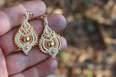 IMPORTANT NOTICE i am currently away from the studio, all jewelry orders will be processed after 16.9.18 Thanks for your patience =) ivory and gold dangle/ drop bridal earrings, made by macrame ( makrame). perfect for the boho bride, or just to add a tribal, ethnic touch to everyday look. I weave these using the ancient technique of macrame from superior quality waxed cord, with 14 kt gold plated muiky beads, goldfilled beads and goldfilled ear wires. length: (including ear wires) 1.9 inches wid White Macrame Dangle Jewelry, Elegant Dangle Macrame Earrings, Elegant Macrame Dangle Earrings, Gold Macrame Earrings For Gift, Bridal Earrings Gold, Drop Bridal Earrings, Boho Drop Earrings, Bridal Earrings Drop, Gold Bridal Earrings