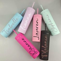 six personalized tumblers with straws in each one and the names on them