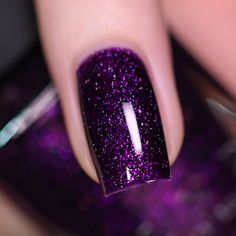 Guest List is a blackened grape nail polish saturated with holographic flakes and magenta sparkle. A token of class that will turn heads as you strut through the door, Guest List will be your sparkling invitation to the party of the year. Sure to impress with its bold base and lustrous pink-to-purple sparkle, Guest List's sparkling holographic micro-flakes put the final seal on this refined violet shade! Guest List is part of the At Midnight Collection, a set of 6 assorted formulas curated with Galaxy Sparkle Nails, Black Nails Purple Glitter, Purple Sparkly Nails Acrylic, Black And Purple Gel Nails, Dark Purple Sparkly Nails, Sparkle Purple Nails, Dark Purple Gel Nails, Teal Nail Color, Purple Nails Sparkle