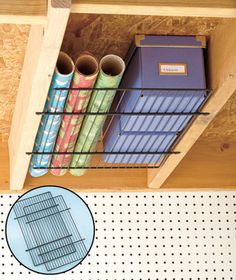 a shelf with some books and binders on it, next to a peg board