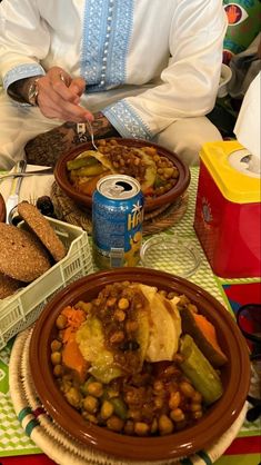 a man sitting at a table full of food