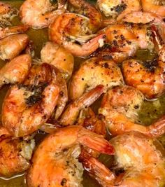 some cooked shrimp are in a pan on the stove