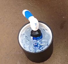 a toothbrush in a cup filled with water