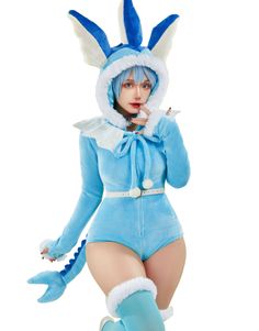 a woman in a blue bunny costume posing for the camera with her hands on her hips