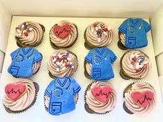 twelve cupcakes decorated in the shape of doctors and nurse's shirts with sprinkles on them