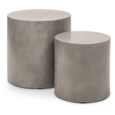 two concrete stools sitting next to each other