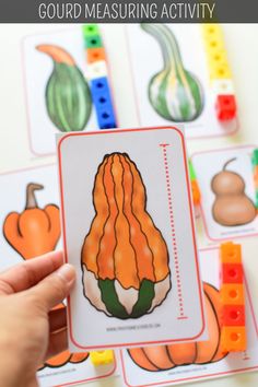 a hand holding up a card with an image of gourd measuring activity