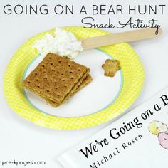 a plate with crackers and cottage cheese on it next to a book about going on a bear hunt