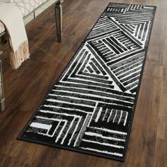 a black and white runner rug in a living room