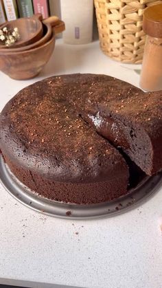 a chocolate cake sitting on top of a white counter