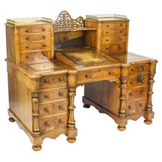 an antique wooden desk with drawers on it