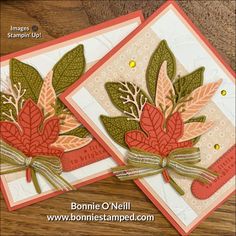 two cards with leaves and ribbons on them