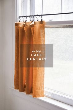 an orange curtain hanging in front of a window with the words as you are, coffee curtain