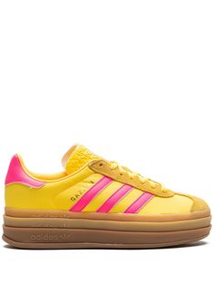 yellow/pink suede logo stamp at side signature 3-Stripes logo contrasting heel counter round toe front lace-up fastening logo-print tongue branded insole gum-rubber sole These styles are supplied by a premium and authenticated sneaker marketplace. Stocking only the most sought-after footwear, they source and curate some of the most hard to find sneakers from around the world. Yellow Sambas, Adidas Gazelle Bold, Gazelle Bold, Yellow Adidas, Rick Owens Women, Pink Sneakers, Print Sneakers, Latest Sneakers, Sneakers Blue