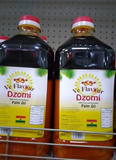 two bottles of flavy dzomi palm oil on a shelf