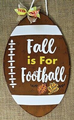 a wooden sign that says fall is for football