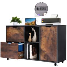 a wooden cabinet with drawers and a laptop on top of it, next to a potted plant