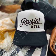 Raising Hell Trucker Hat, Nashville Style Trucker Hat | Bachelorette Girls Weekend Hat | Cowgirl Style | Trucker Hat Transform any evening out or errand journey into a fiesta with this lively Raising Hell Trucker Hat! Constructed with 100% nylon mesh, it's ideal for brides-to-be, ladies night out, or for adding a bit of sassy flair to your everyday adventures. Prepare to unleash the fun! (And remember to drink responsibly!) Nashville Style Trucker Hat | Bachelorette Girls Weekend Hat | Cowgirl Style | Trucker Hat Nashville Style, Drink Responsibly, Macrame Wall Decor, Leather Decor, Everyday Adventures, Ladies Night, Girls Weekend, Dress Hats, Cowgirl Style