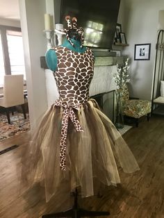 a giraffe print dress on display in a living room