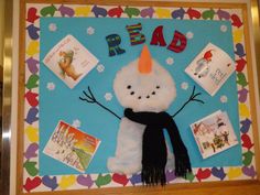 a bulletin board with a snowman and books on it