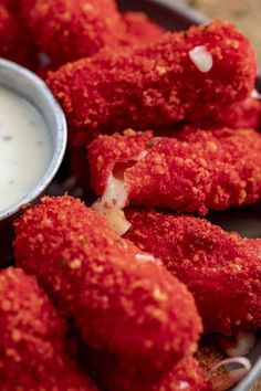 deep fried food with dipping sauce on the side