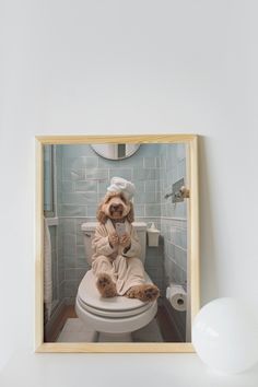 a dog in a bathrobe sitting on top of a toilet seat with the lid up