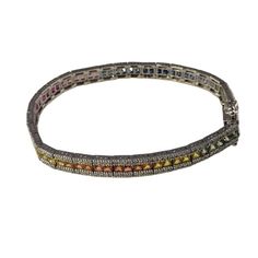 14 Karat White Gold Diamond and Natural Multi Sapphire Rainbow Style Bracelet  This lovely bracelet features 274 round brilliant cut diamonds and 69 French cut natural sapphires set in 14K white gold. Width: 6 mm.  Total sapphire weight: 7.59 ct.  Total diamond weight: 1.50 ct.  Diamond color: H-I  Diamond clarity: SI1-SI2  Size: 7 inches  Weight: 10.2 dwt. / 15.9 gr.  Stamped: 14K  JAGi Certificate included. Diamond Multi-stone Tennis Bracelet, Multi-stone Diamond Tennis Bracelet, Round Diamond Multi-stone Tennis Bracelet, Silver Multi-stone Diamond Bracelet, Fine Jewelry Silver Diamond Bracelet With Multi-stones, Multi-stone Round Diamond Bracelet For Anniversary, Multicolor Diamond Bracelet With 17 Jewels, Formal Multi-stone Cubic Zirconia Tennis Bracelet, Luxury Multi-stone Tennis Bracelet For Anniversary