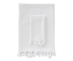 two white towels with tassels on them