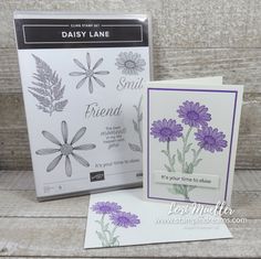 two cards with purple flowers on them, one is for daisy lane and the other is for