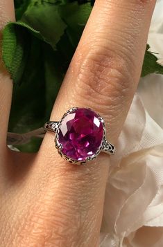 "Natural Pink Topaz Ring Edward Design#70 (smaller version) Custom Made Inspired by Edwardian jewelry of the early 1900s, I now offer this lovely Antique reproduction ring in sterling silver. This gorgeous ring is set with a stunning Natural Pink Topaz gemstone. This genuine pink topaz has excellent color and clarity. The oval cut 3.41ct Topaz is 12mm (9/16th of an inch) Long by 10mm Wide (3/8th\"). The ring sits 6mm off the finger. The inside of the band s marked 925 for sterling. Notice the be Ornate Round Topaz Gemstone Ring, Round Filigree Ring With Gemstone, Topas Ring, Pink Topaz Ring, Edwardian Jewelry, Order Design, Gorgeous Ring, Pink Topaz, Sterling Silver Filigree