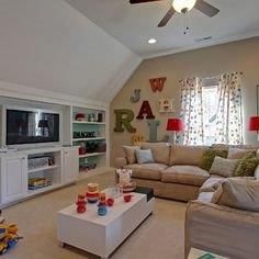 a living room filled with furniture and a flat screen tv