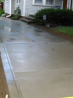 the sidewalk is clean and ready to be used as a walkway for children or adults