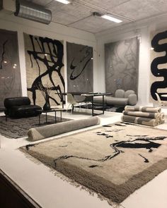 a living room filled with lots of furniture and rugs