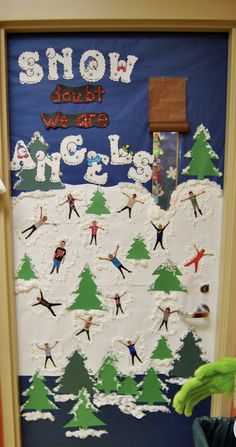 a door decorated with snow skiers, trees and the words show what we are doing