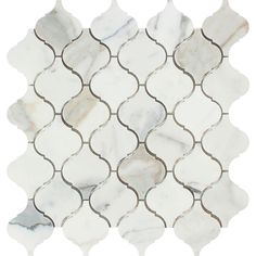 white and silver mosaic tile with wavy lines on the back side, in an irregular pattern