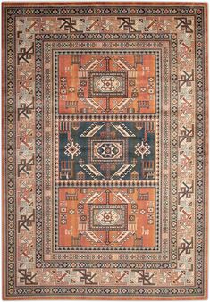 an orange, blue and black rug with geometric designs on the bottom half of it