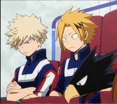 two anime characters sitting next to each other in front of a red chair with their arms crossed