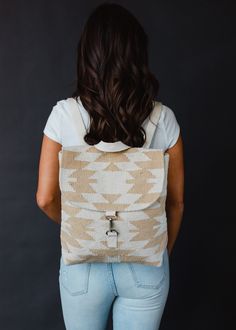 You'll be ready for your everyday outings with our backpack collection! This cream and tan Aztec inspired backpack is just what you need for an upcoming vacation, or for running errands. Cream and tan Aztec inspired backpack Clasp closure on the front Adjustable straps and handle Measures 14" x 11.5" x 4.5" Designed in the U.S.A. Produced in India. 100% Cotton Lining: 100% Polyester Beige Standard Backpack For On-the-go, On-the-go Beige Backpack, Cream Leather Backpack For Daily Use, Beige Backpack With Adjustable Strap, Cream Satchel Backpack For Everyday, Everyday Beige Backpack, Cream Leather Backpack For Everyday Use, Cream Backpack With Adjustable Strap For Everyday Use, White Canvas Backpack For Everyday Use