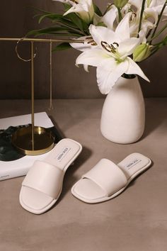 white leather slip on dream a little dream slide sandal on cement background Leather Slide Sandals, Leather Slides