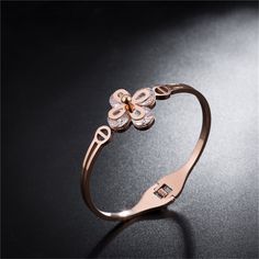 Elevate your ensemble with the timeless glow of this bangle plated with romantic rose gold. Sparkling crystal embellishments increase the splendor. 0.87'' W x 2.36'' diameter Spring ring clasp 18k rose gold-plated titanium steel / crystal Gold Butterfly Ring, Butterfly Ring, Romantic Roses, Gold Butterfly, Crystal Embellishment, Sparkling Crystal, Spring Rings, 18k Rose Gold, Rose Gold Plates