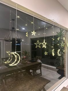 the window is decorated with stars and moon lights