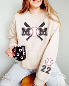 This cute Baseball Mom sweatshirt is fun to customize with your team colors and kids' names on the sleeve. It's perfect for those chilly spring days at practice and games. Printed on high-quality Gildan sweatshirts with water-based inks, it'll last season after season! ⭐Details: �✨ Gildan 18000 ✨ Classic fit ✨ Runs true to size ✨ Medium-heavy fabric ✨ Tear-away label ✨ 50% cotton, 50% polyester ⭐Care: Machine cold inside out (max 40C or 105F); Tumble dry: low heat; Do not dry-clean. ⭐Current Prod Baseball Gear, Mom Sweater, Team Mom, Personalized Baseballs, Kids Names, Gildan Sweatshirts, Sports Mom, Change Of Address, Mom Sweatshirt