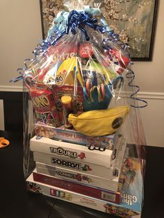 a clear bag filled with books and snacks