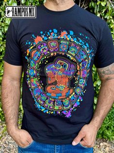 Handmade Serigraphy Print, Mexican Mens Aztec Warrior Piramids T-Shirts Graphic Tees that are super stylish , bright and glow in Blacklight , Neon Lights, Mexican Art Skull Luchador shirts , made by Artisans in Mexico in several designs . Mexican men Shirts. Short sleeve Men's apparel made of ultrasoft 100% cotton, this comfortable style is designed with a classic crew neckline, short sleeves and relaxed Fit, Our t-shirt is a perfect gift for that special person near you. Playera Mexicana de Luchador Santo Artesanal.  Please check the Product images for Size measurements guide Follow us in Instagram and Facebook: @RamposMX Black Rave T-shirt With Screen Print, Multicolor Short Sleeve T-shirt For Festivals, Multicolor Graphic Print Shirt For Festivals, Multicolor Graphic Print Festival Shirt, Short Sleeve T-shirt With Sublimation Print For Festival, Artistic Graphic Print Festival Tops, Artistic Graphic Print Tops For Festivals, Multicolor Screen Print Tops For Fan Merchandise, Glow In The Dark Graphic Tee With Short Sleeve