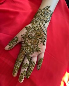 a woman's hand with hennap on top of her arm and hands