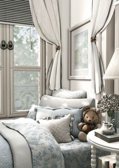 a teddy bear sitting on top of a bed in a room with white walls and curtains