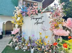 a sign with flowers on it in front of a building that says happy apret