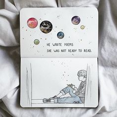 there is a card with an image of a person sitting on the bed and planets in the background